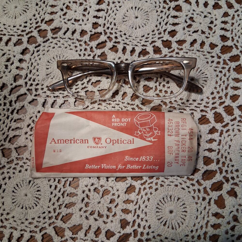 American Optical New old stock eye glasses brown ticker tape fadeaway 46x32 1/2